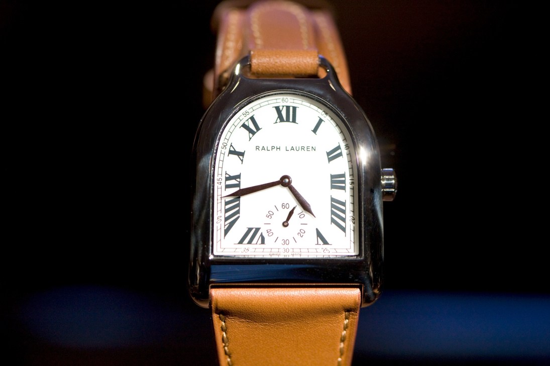 Ralph Lauren luxury watch with brown leather strap and white dial featuring Roman numerals.