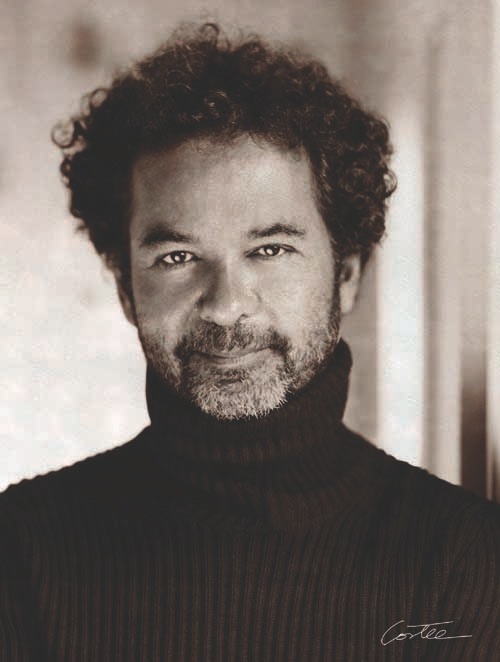 Portrait of Remo Ruffini, president of Moncler, wearing a black turtleneck.