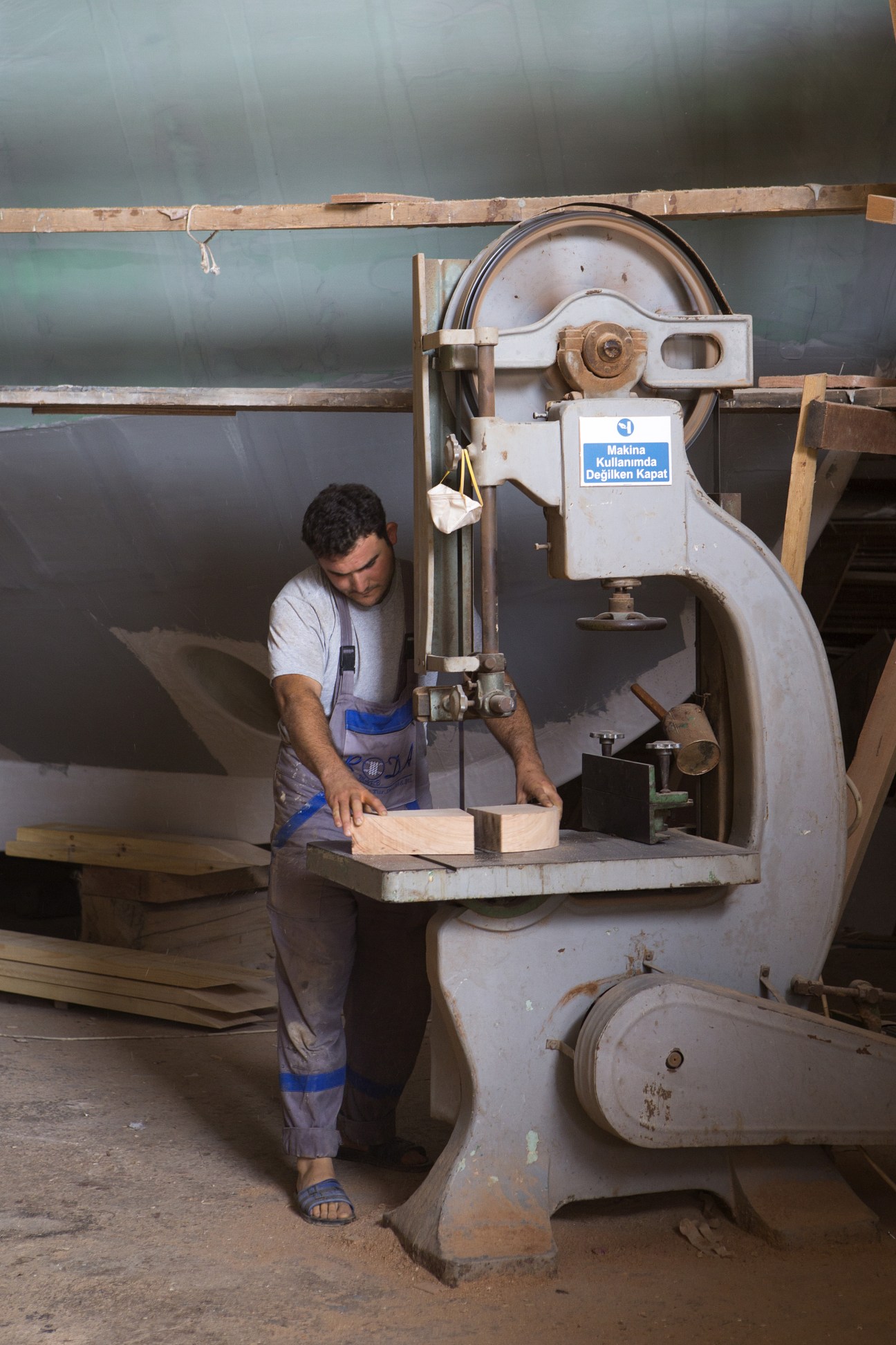 A carpenter operates an industrial saw at Roda boatyard in Bodrum, Turkey.