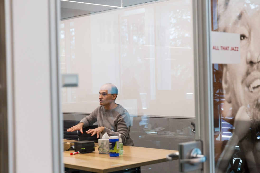 Todd Yellin, Netflix VP of product innovation, gesturing while speaking in an office meeting room.