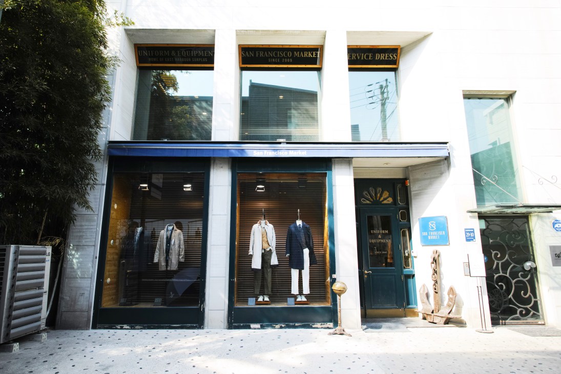 San Francisco Market storefront in Seoul with mannequins dressed in tailored clothing displayed in windows.