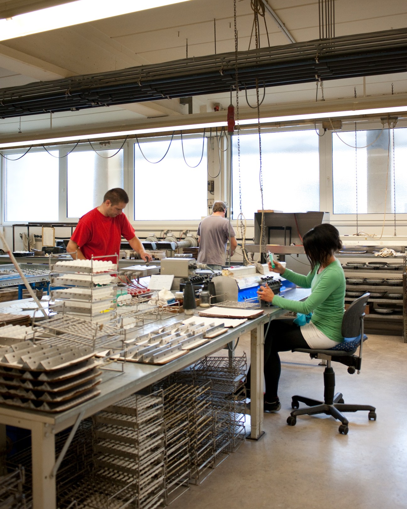 Workers assembling binoculars at Steiner's production line in Bayreuth, Germany.