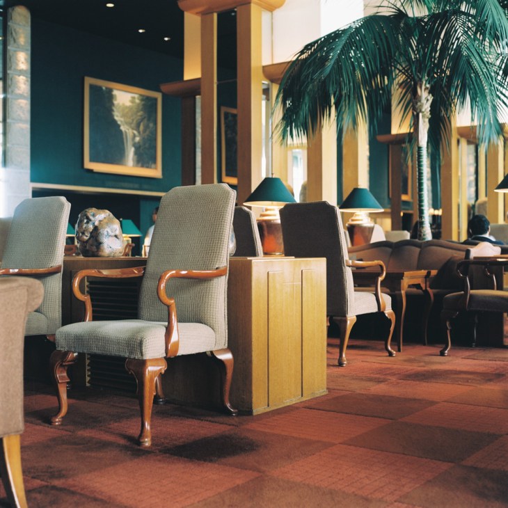 Grand Hyatt Seoul lobby with upholstered chairs, palm plants, and warm lighting