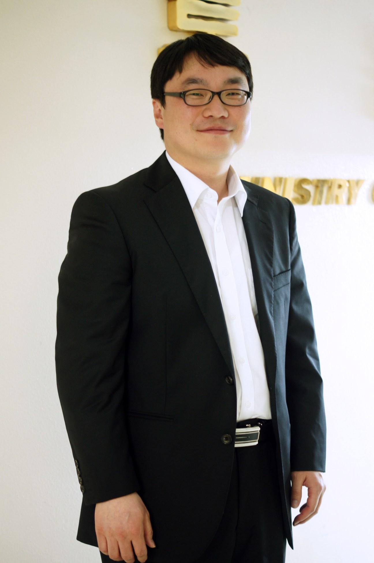Hwang Seunghee, senior ministry official in charge of South Korean unification plans, wearing a black blazer and glasses.