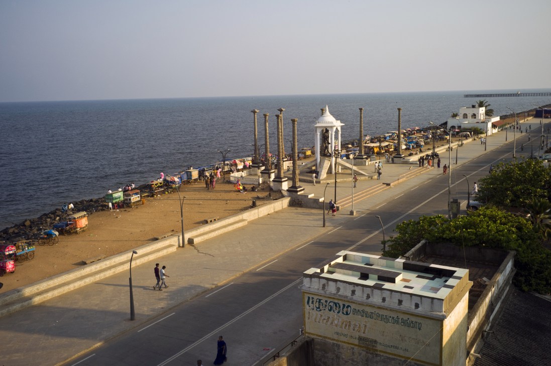 Pondicherry's vehicle-free seafront promenade with white gazebo, beach, and colonial architecture.