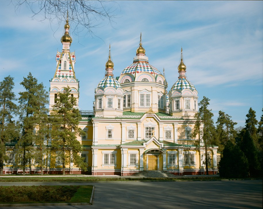 Almaty's Ascension Cathedral with golden domes and colorful patterned cupolas built entirely of wood in 1907.