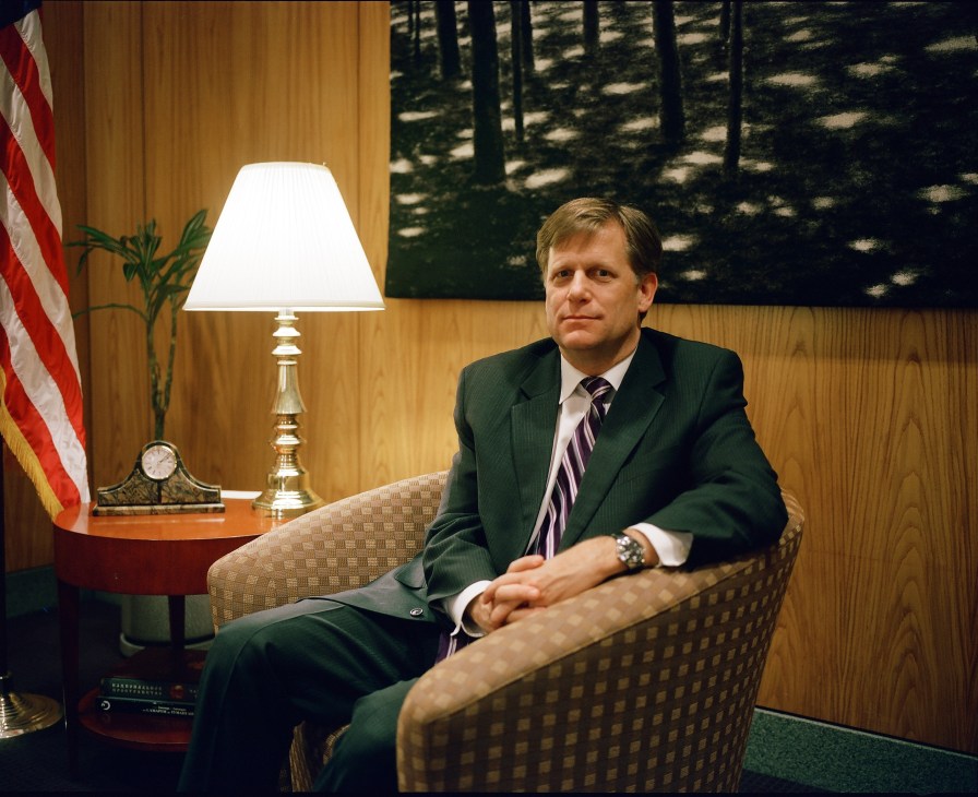 Michael McFaul, US ambassador to Russia, seated in a formal office with wood paneling and American flag