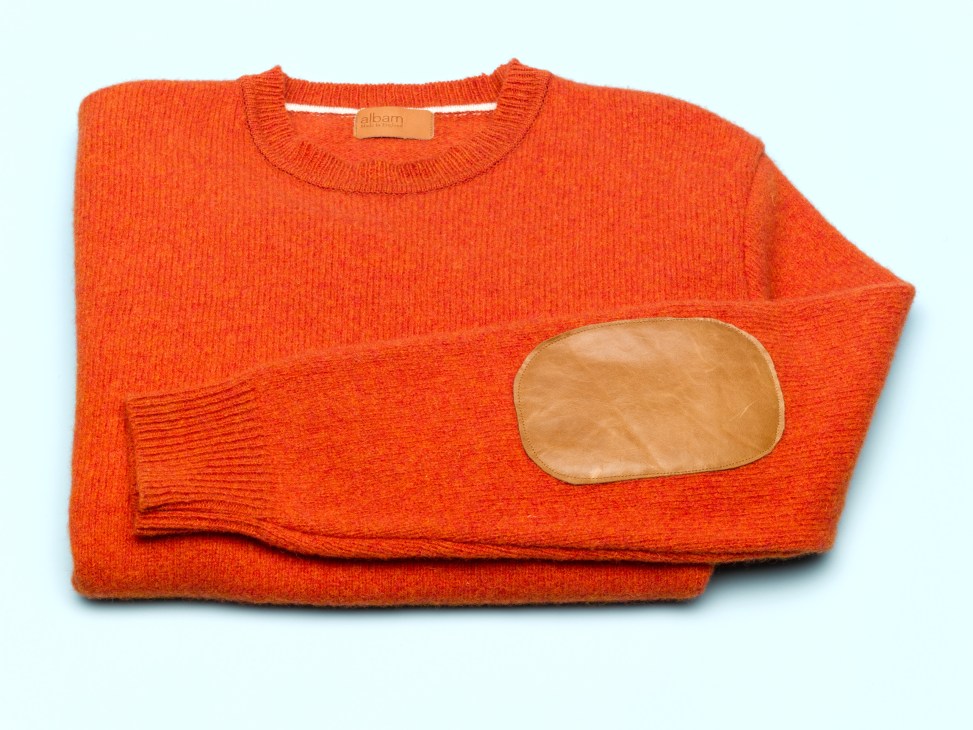 Albam Shetland wool roundneck sweater in orange with tan leather patch pocket detail.