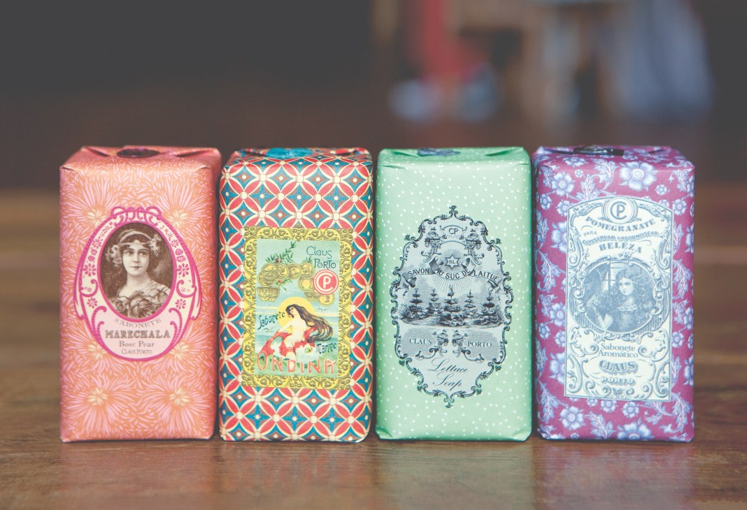 Four wrapped Claus Porto soap bars with vintage Art Deco labels in pink, orange, green and purple.