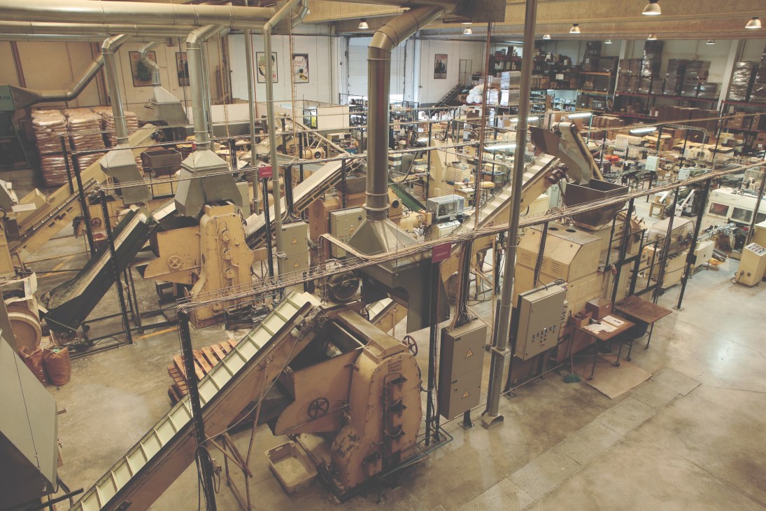 Interior of Ach. Brito soap factory showing vintage machinery and equipment from the 1940s.