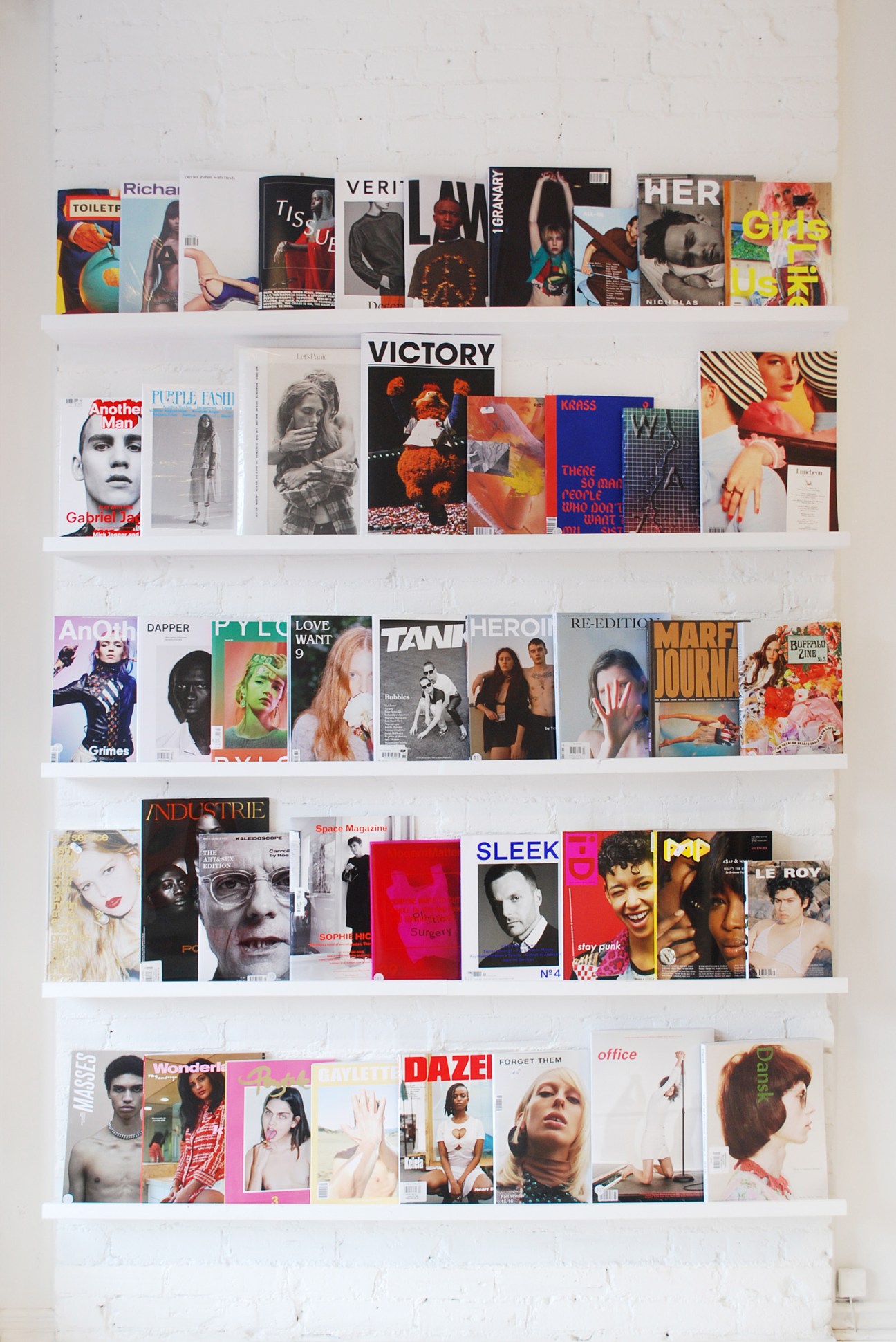 Magazine display wall at Soop Soop featuring various fashion and culture publications