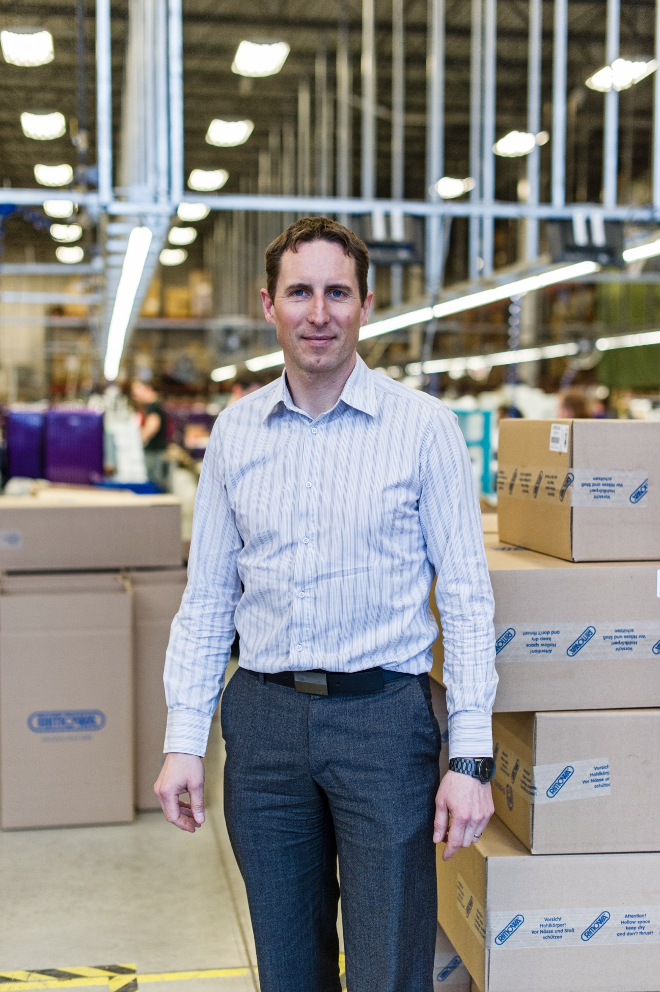 Carsten Kulcke, Rimowa's regional vice-president, standing in the Cambridge manufacturing facility.