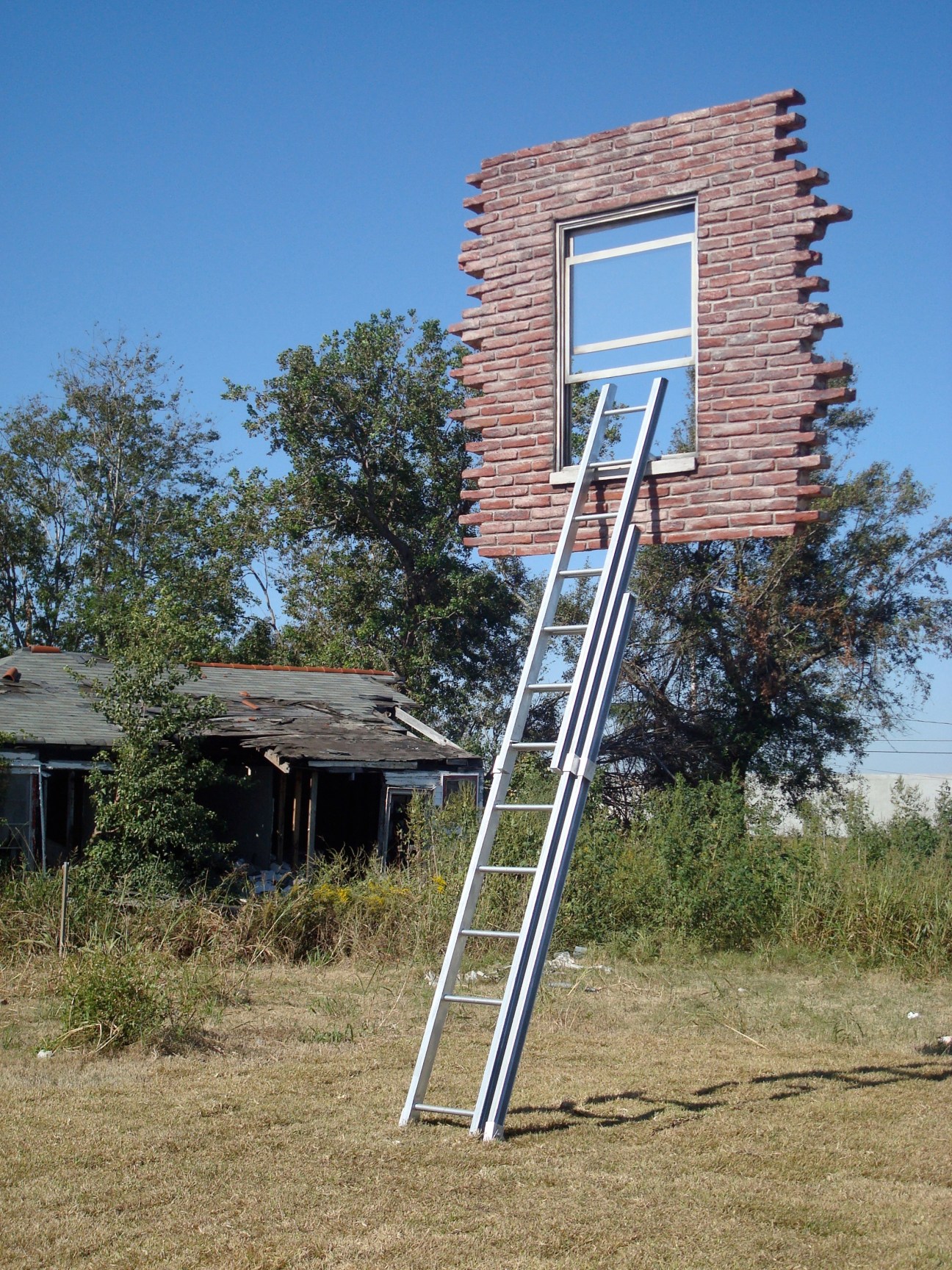 Brick structure with window and ladder by Leandro Erlich, titled Window and Ladder – Too Late For Help.