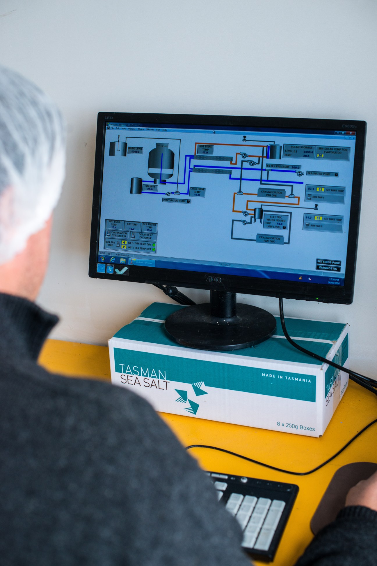 Chris Manson checks a computer system displaying a schematic diagram of Tasman Sea Salt's production equipment.