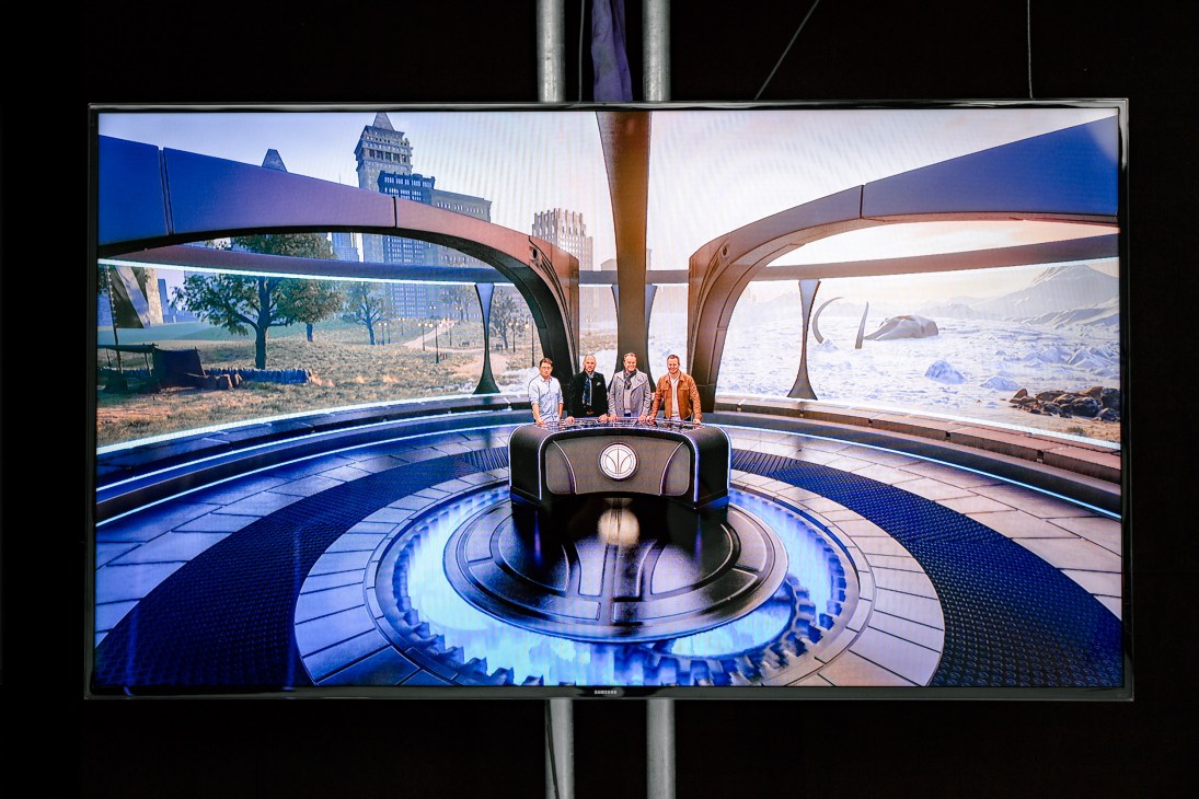 Lost in Time TV show display showing four contestants in a futuristic virtual environment with split-screen backdrops.