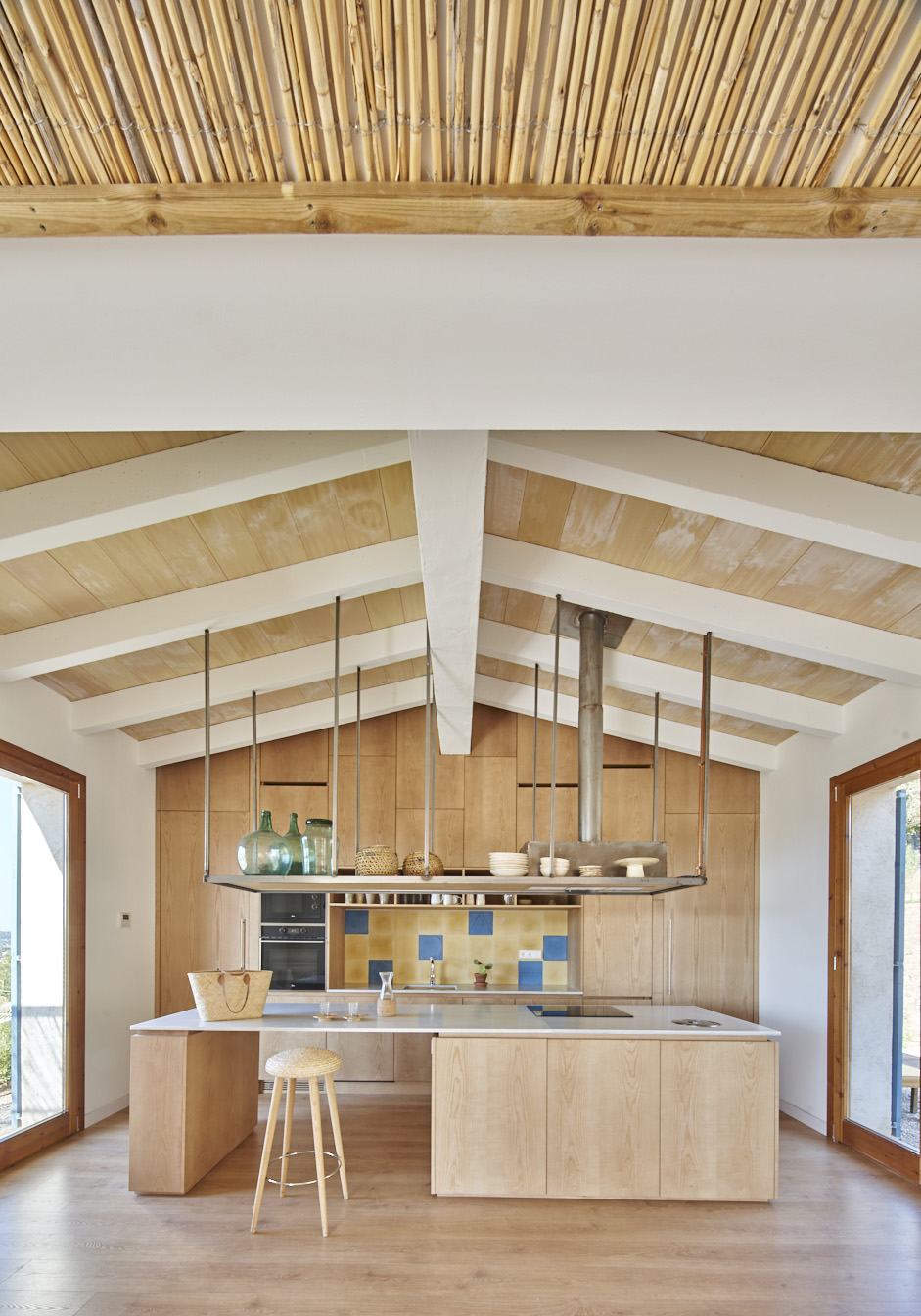 Kitchen with concrete roof supports usually used in agricultural buildings