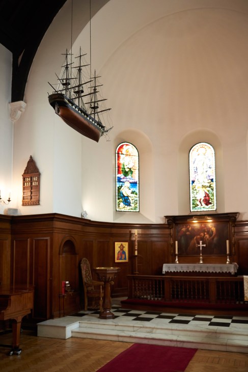 Model cargo ship suspended above altar in St Olav's Norwegian Seaman's Mission chapel.