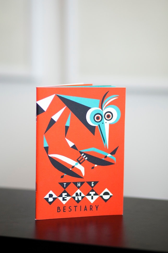 Ben Newman's 'The Bento Bestiary' book with orange cover and illustrated bird design.