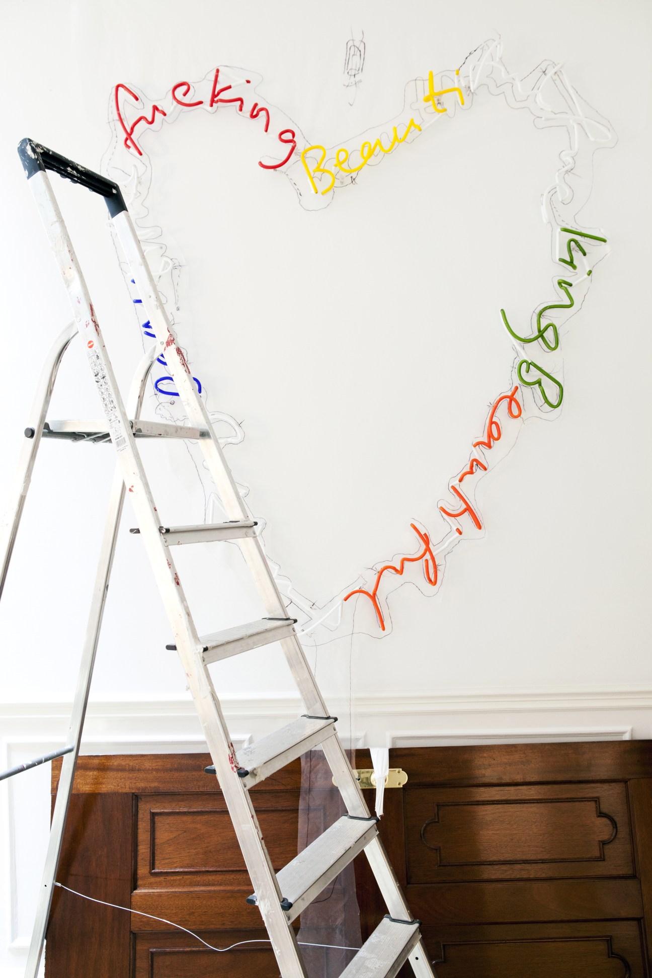 'Fucking Beautiful' by Tim Noble and Sue Webster, a neon light sculpture on a ladder