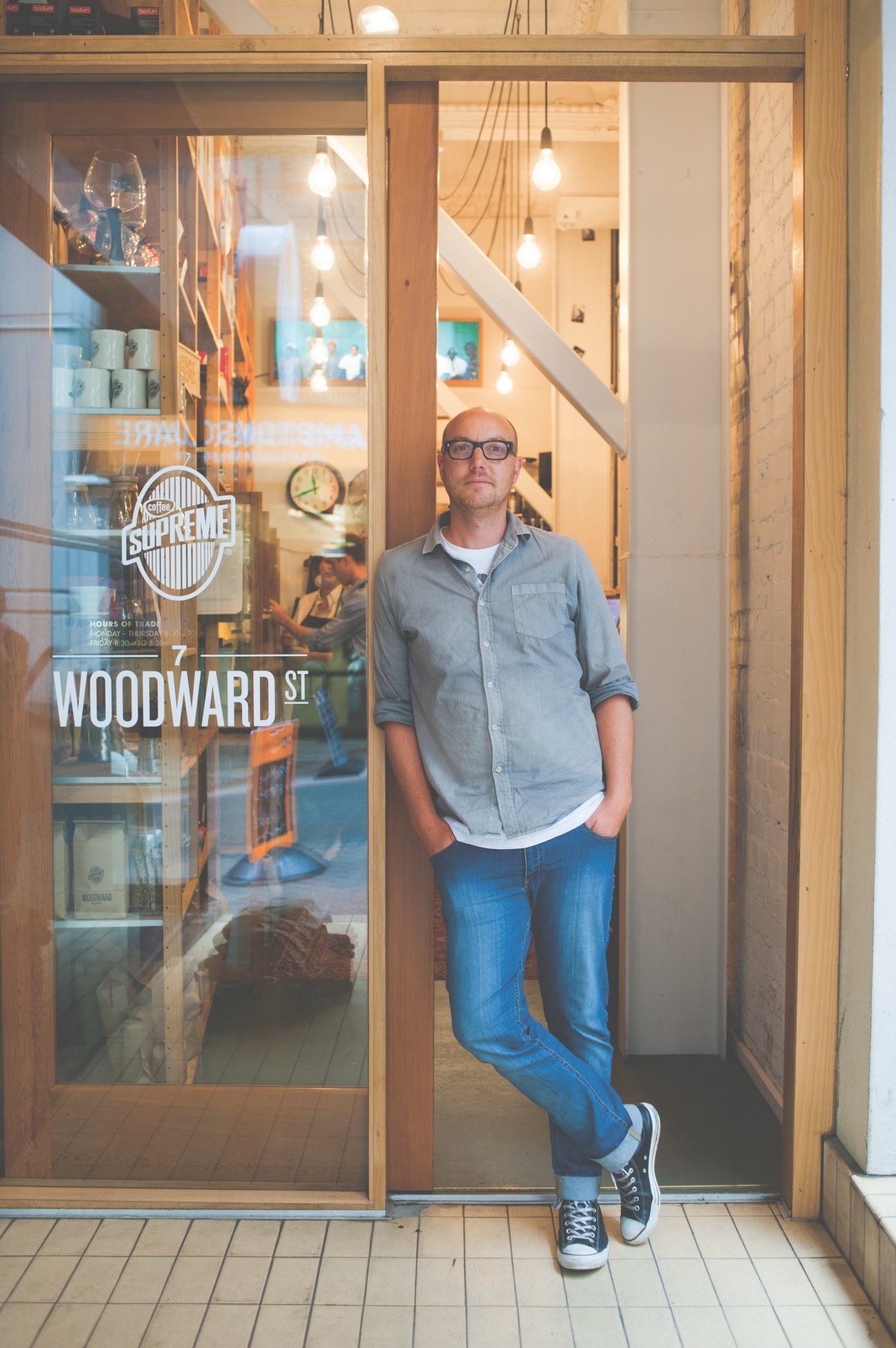Alastair Keating, MD of Coffee Supreme, stands in a doorway on Woodward Street in Wellington.