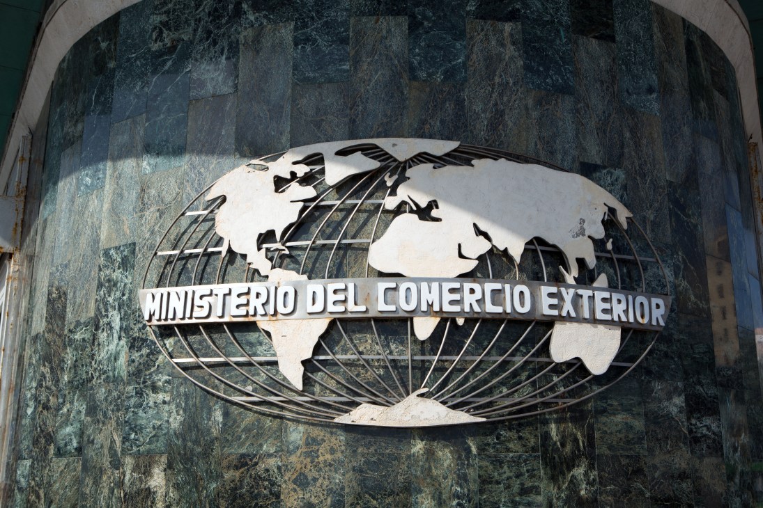 Cuba's ministry of foreign trade building sign with a globe and text reading 'Ministerio del Comercio Exterior'