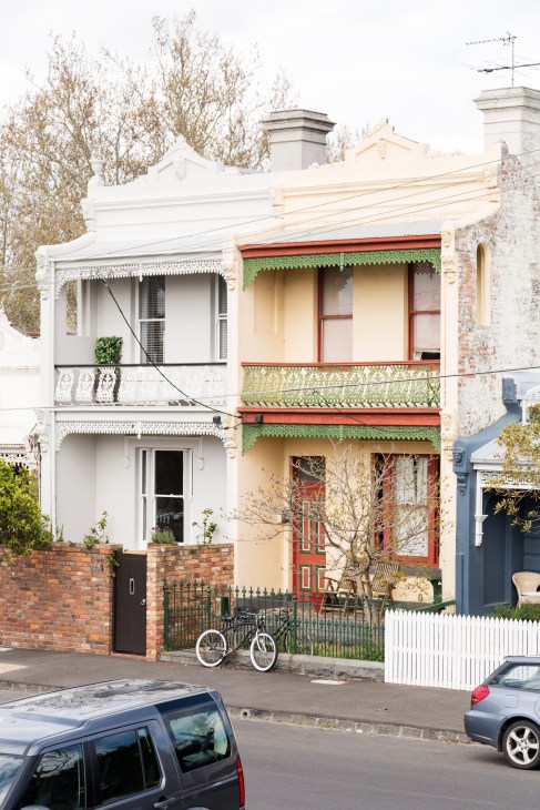 Two adjacent Victorian townhouses with ornate details on Turner Street in Abbotsford, Melbourne.