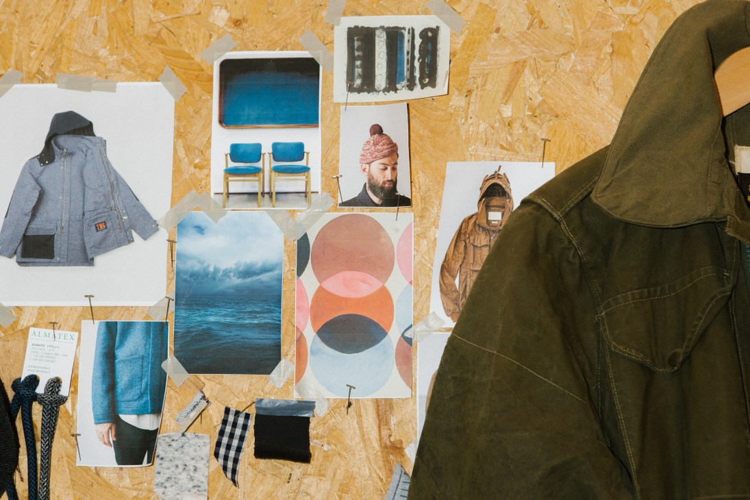 Design inspiration moodboard with fabric swatches and sketches pinned to OSB board