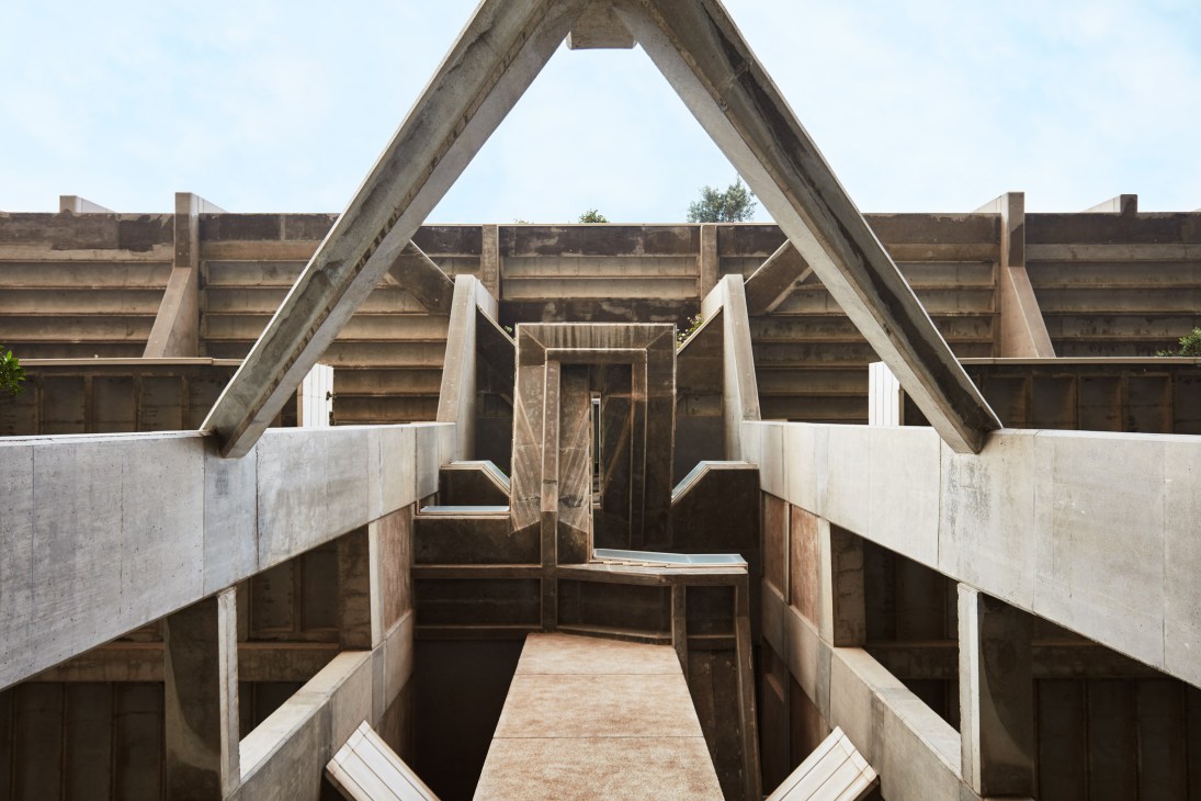 Brutalist concrete stairway with geometric triangular structure at Espai Verd in Valencia.