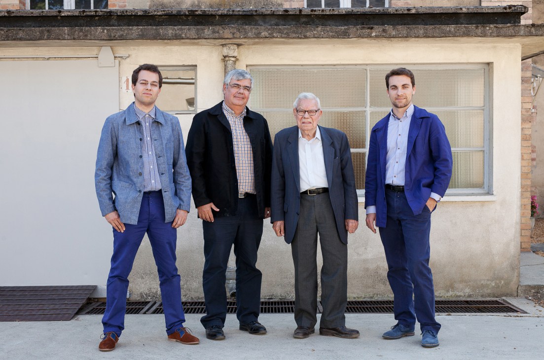 Four men standing outside a building: Patrick Beerens and family members of Vétra workwear company.