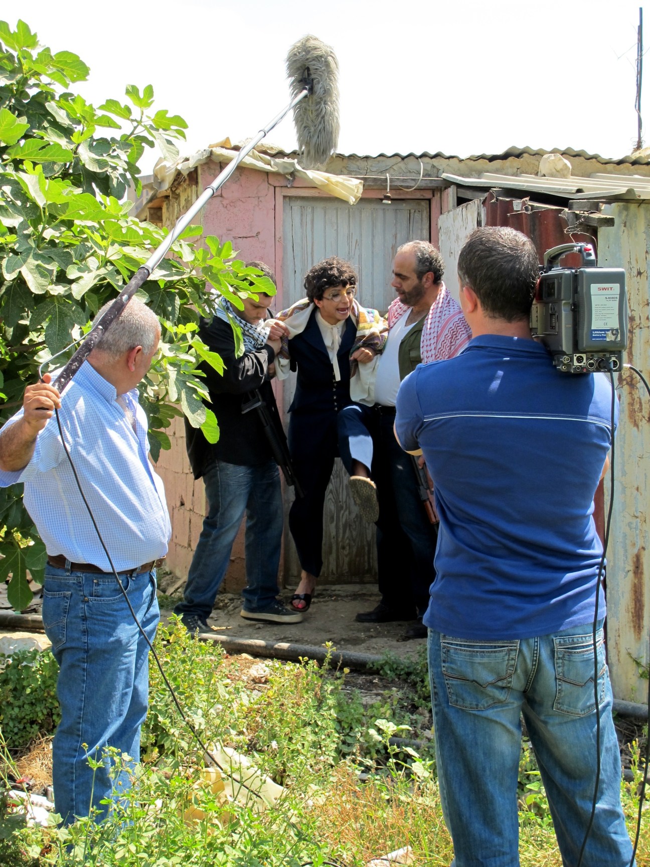 Film crew shooting Basmet al-Watan with actress Zeina Daccache on a rooftop in Beirut.