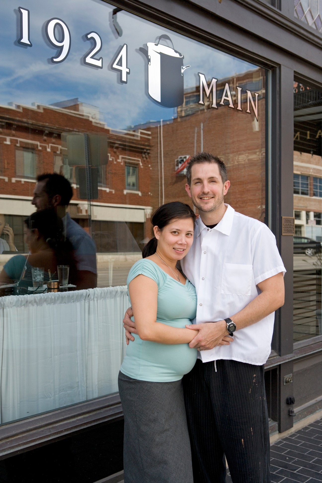 Chef Rob Dalzell and his wife Margarita stand together outside their restaurant at 1924 Main Street in Kansas City.
