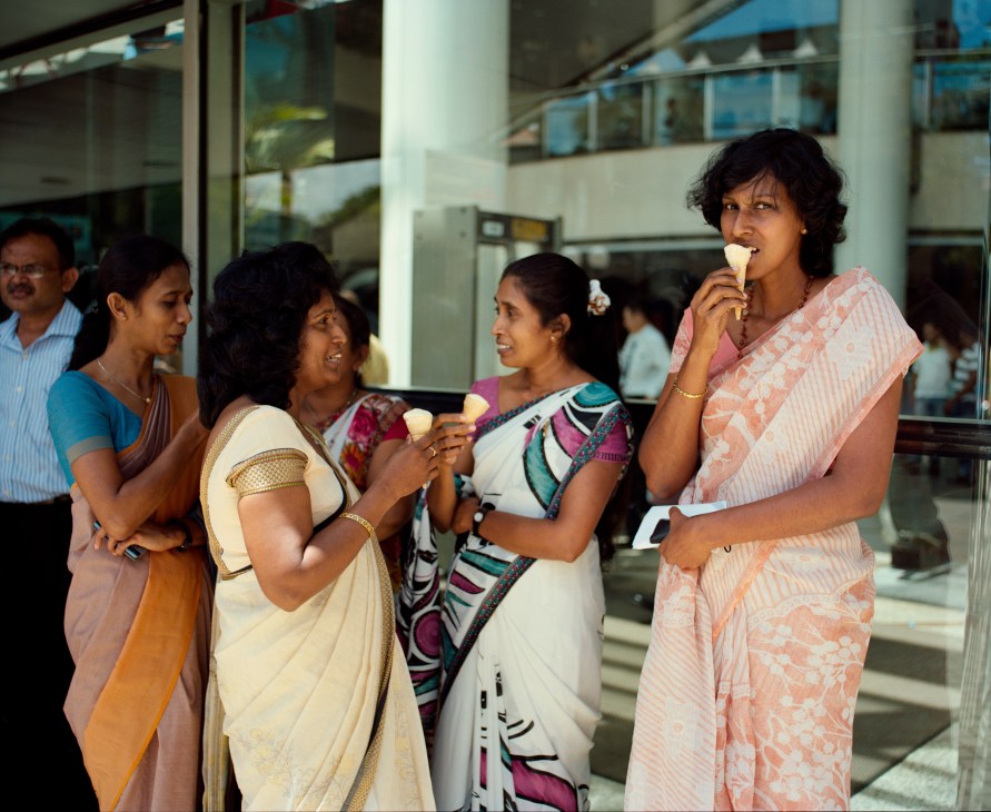Women eating ice cream and chatting near the World Trade Centre in Colombo.