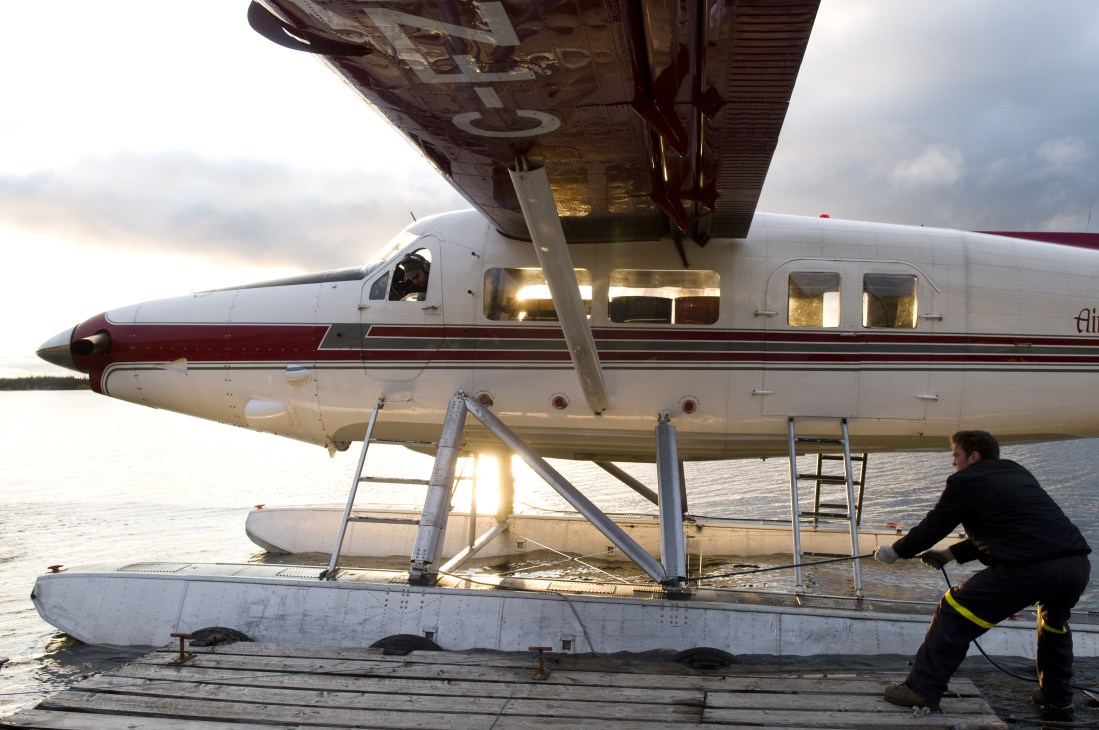 Air Tindi seaplane with floats at a dock on Lou Lake in Yellowknife, Northwest Territories.