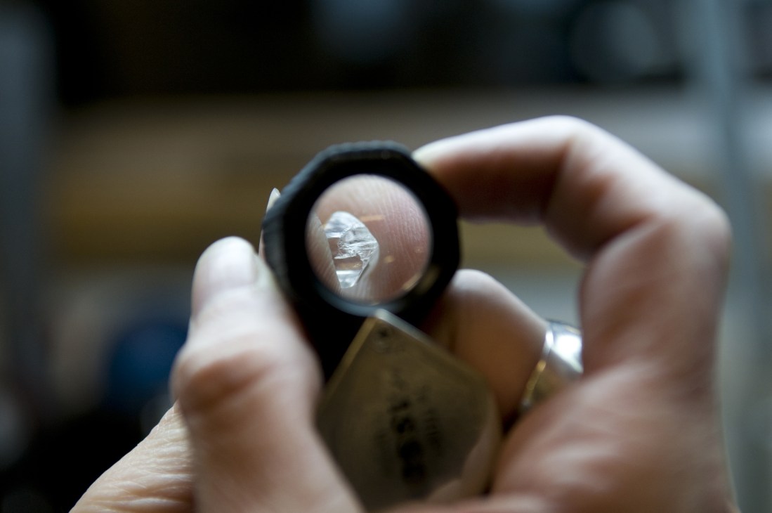 A raw diamond held under magnification at the Arslanian Cutting Works in Yellowknife.