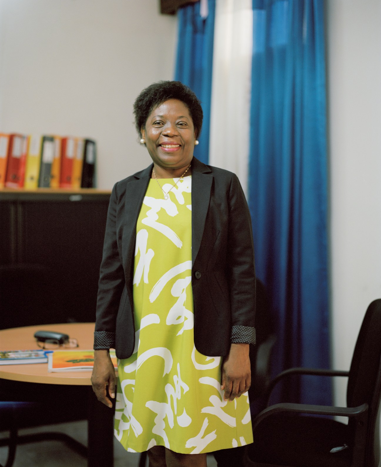 Elsa Cardoso, director-general of the National Institute of Statistics, smiles in her office.